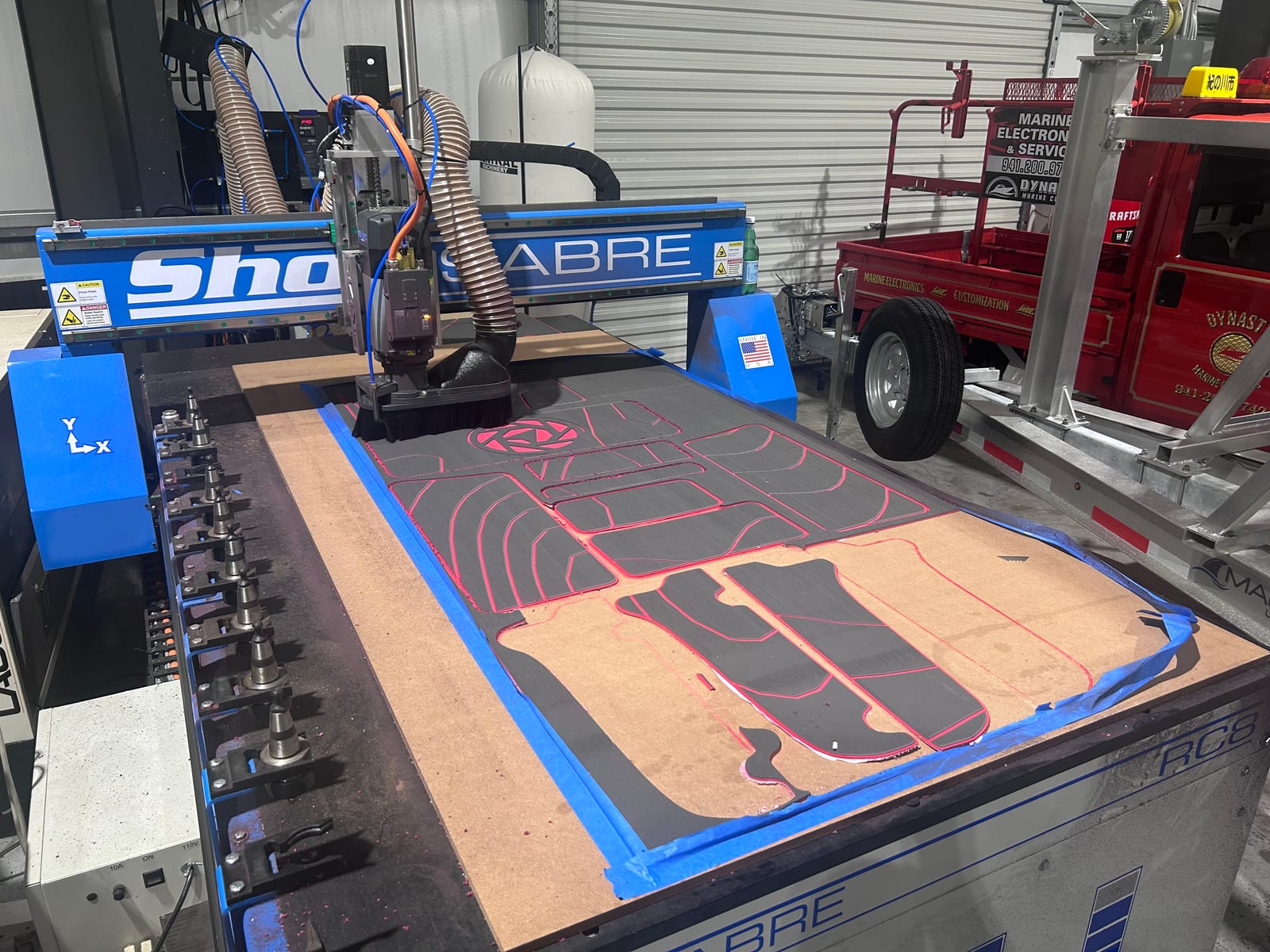 Custom non-skid marine decking pads being CNC-cut to a 3D scan at the ScanForge 3D shop